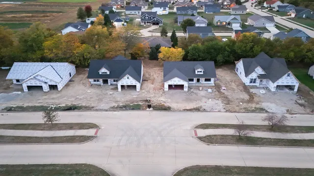 an aerial view of a house with garden space and street view