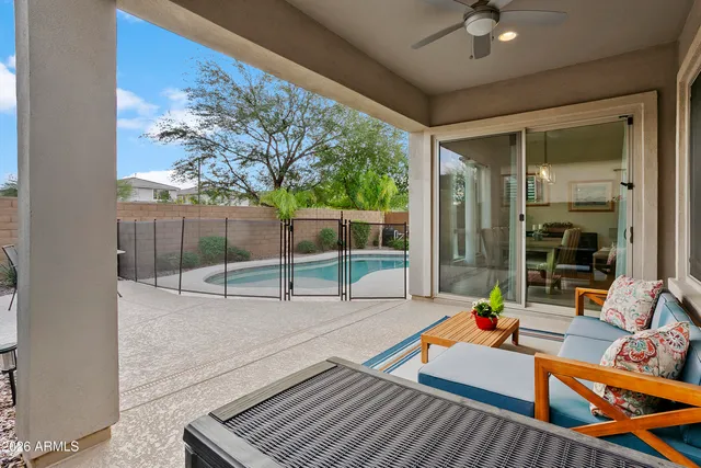 a view of a patio with a table and chairs