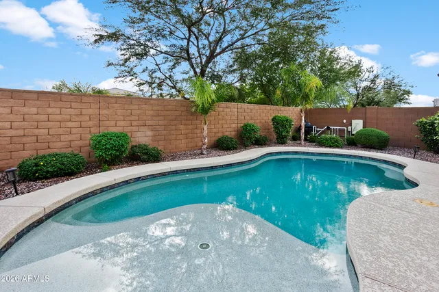 a view of a swimming pool with a patio