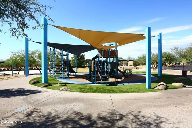 a view of a patio with a table and chairs
