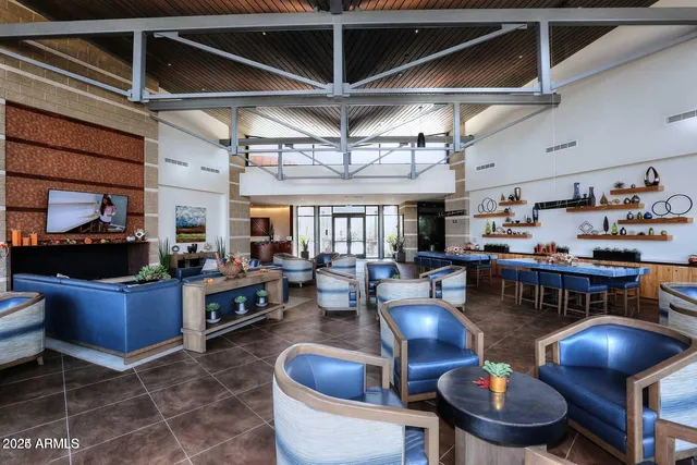 a kitchen with stainless steel appliances granite countertop a sink a stove and a wooden cabinets