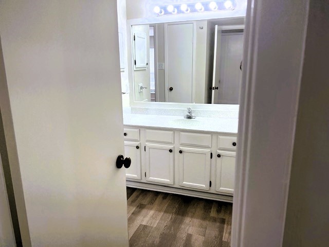 2025 Augusta Drive, Unit 804 Houston, TX 77057 - Photo 20 of 28 Bathroom with single sink and lots of storage access from hall and bedroom both