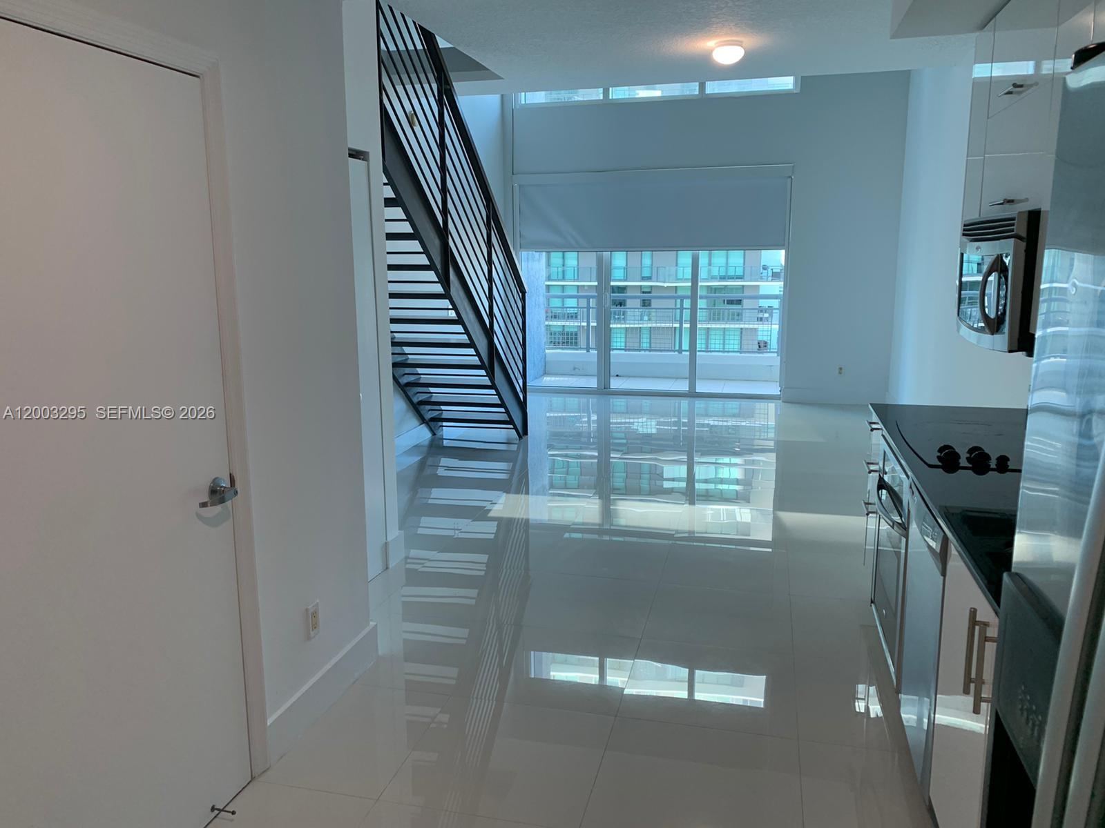 60 Southwest 13th Street, Unit 3202 Miami, FL 33130 - Photo 1 of 13 a view of entryway and hall with a window