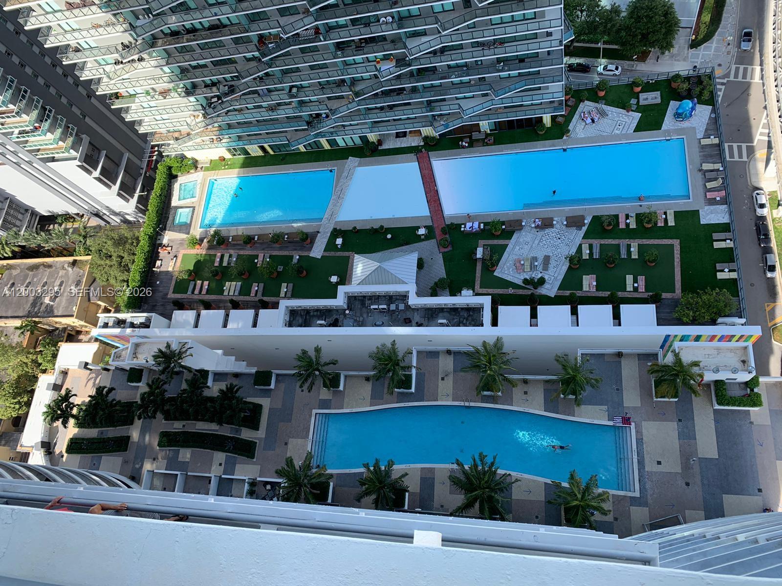 60 Southwest 13th Street, Unit 3202 Miami, FL 33130 - Photo 12 of 13 a store with outdoor seating and yard