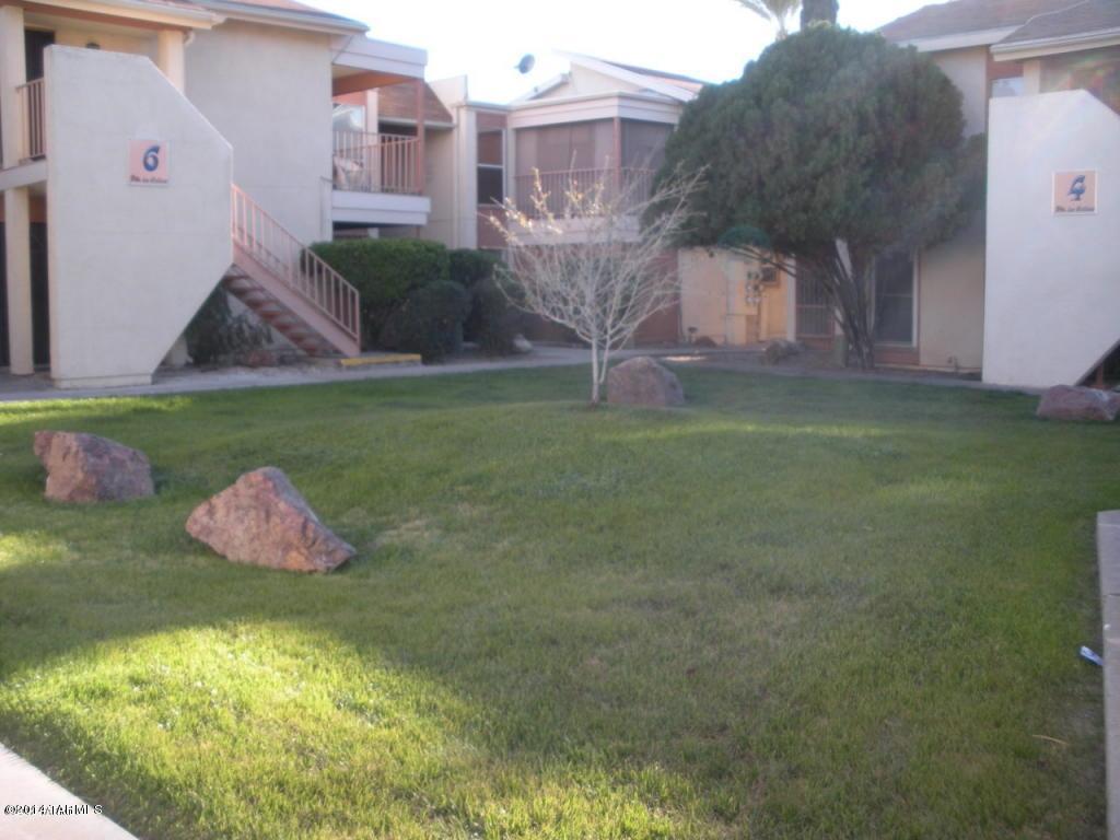 1600 North Wilmot Road, Unit 245 Tucson, AZ 85712 - Photo 8 of 12 a view of a house with a yard
