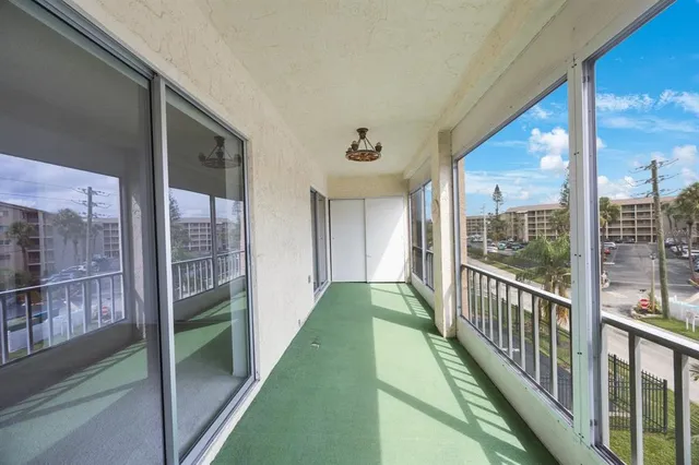 a view of a patio with table and chairs potted plants