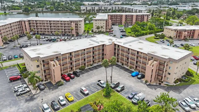an aerial view of a house with a yard basket ball court and outdoor seating