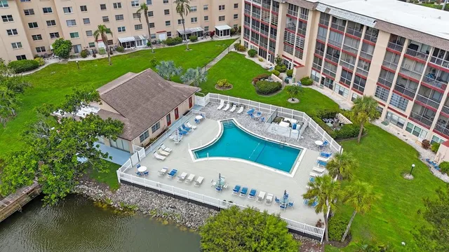 a view of a chairs and table on the river