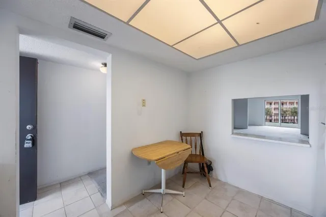 a kitchen with cabinets appliances a sink and a window