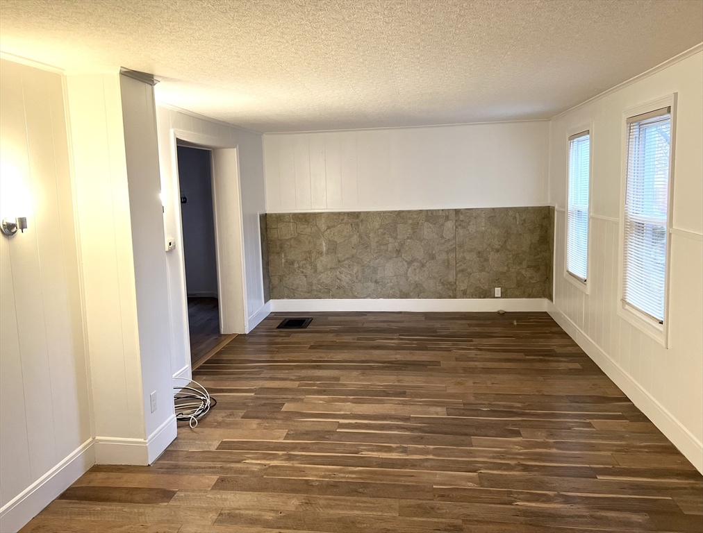 47 Lansing Place, Unit 1 Springfield, MA 01108 - Photo 6 of 10 a view of an empty room with wooden floor and a window