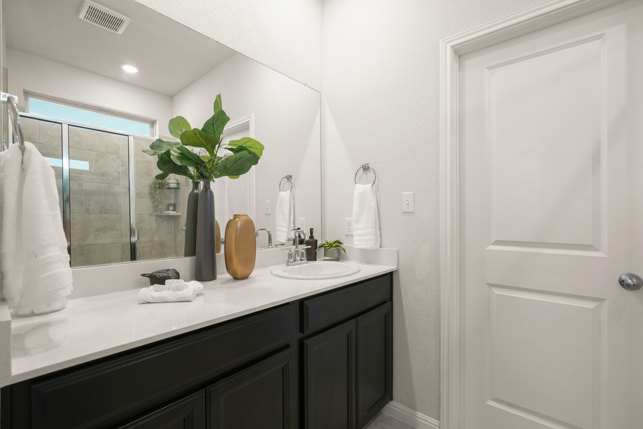 152 Mountain Valley Street Georgetown, TX 78628 - Photo 12 of 38 Clean lines and a stylish vanity define this modern bathroom space.