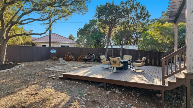 a view of a backyard with sitting area and furniture