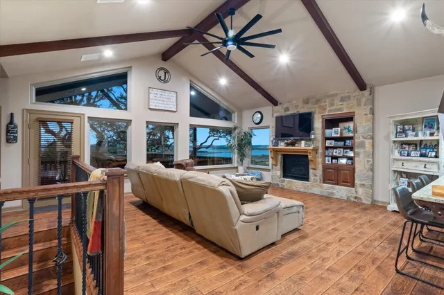 a living room with fireplace furniture and a flat screen tv