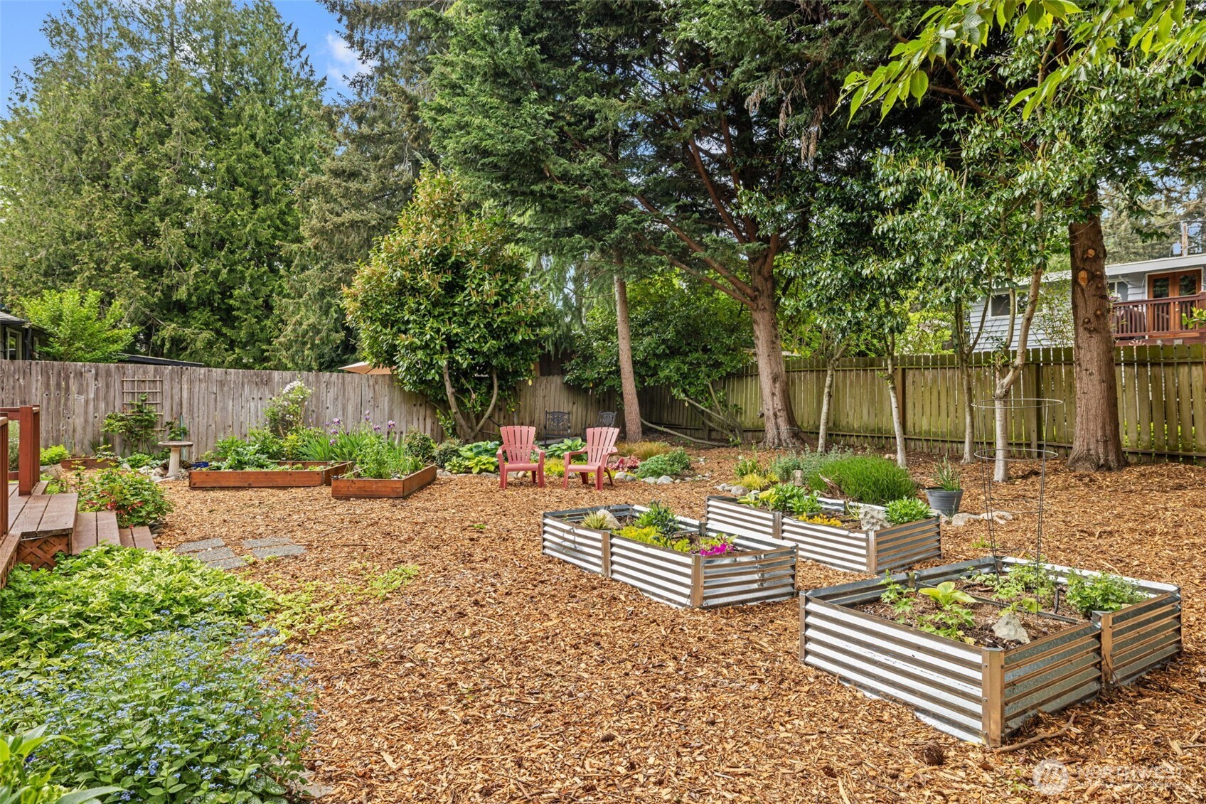 8629 223rd Street Southwest Edmonds, WA 98026 - Photo 27 of 40 a view of a chair and tables in the garden