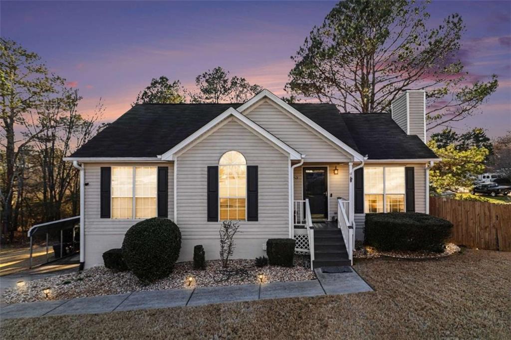 211 Stoney Point Cove Carrollton, GA 30116 - Photo 2 of 38 a front view of a house with garden