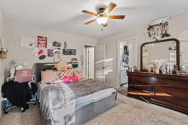 a bed room with a bed and a chandelier