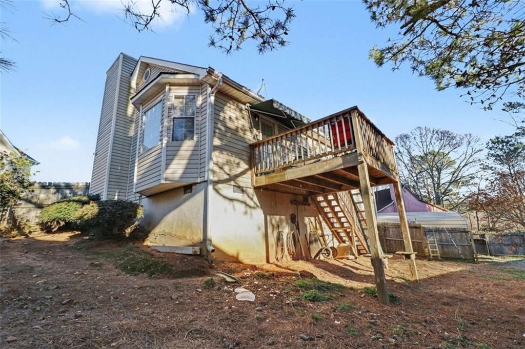211 Stoney Point Cove Carrollton, GA 30116 - Photo 32 of 38 a view of a house with a yard
