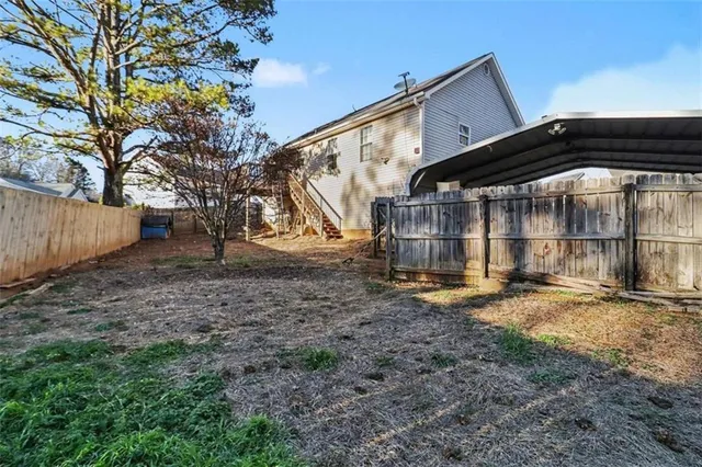 a backyard of a house with lots of green space