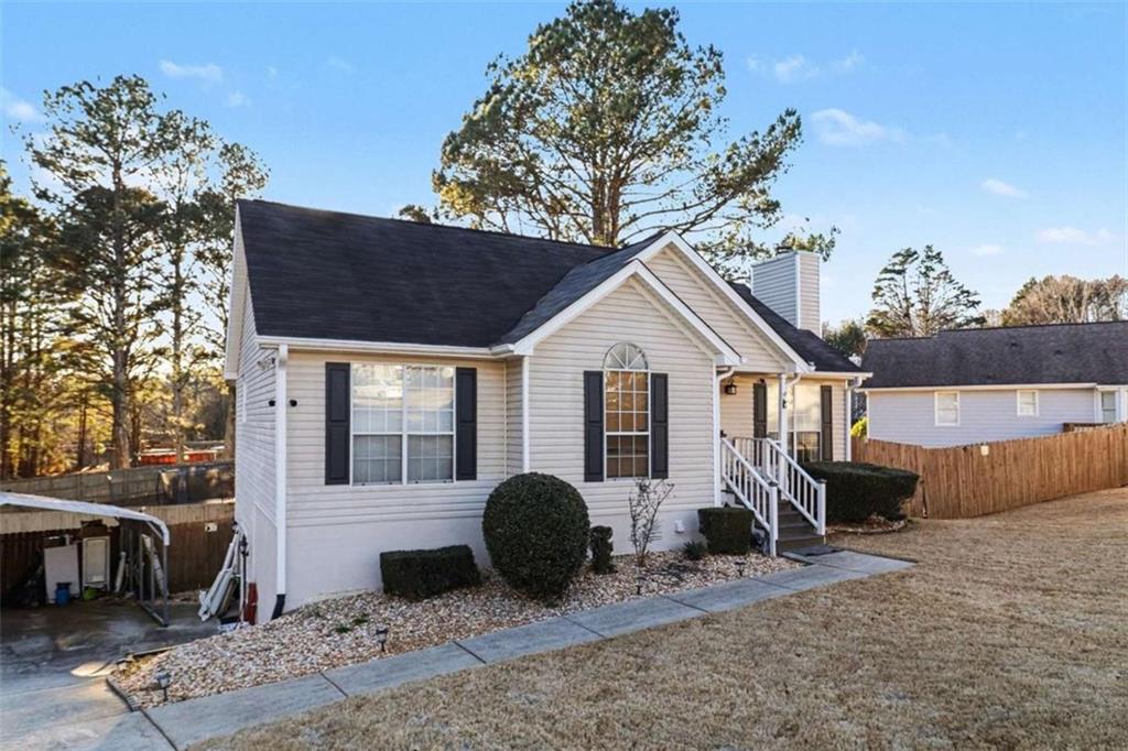 211 Stoney Point Cove Carrollton, GA 30116 - Photo 5 of 38 a front view of a house with garden