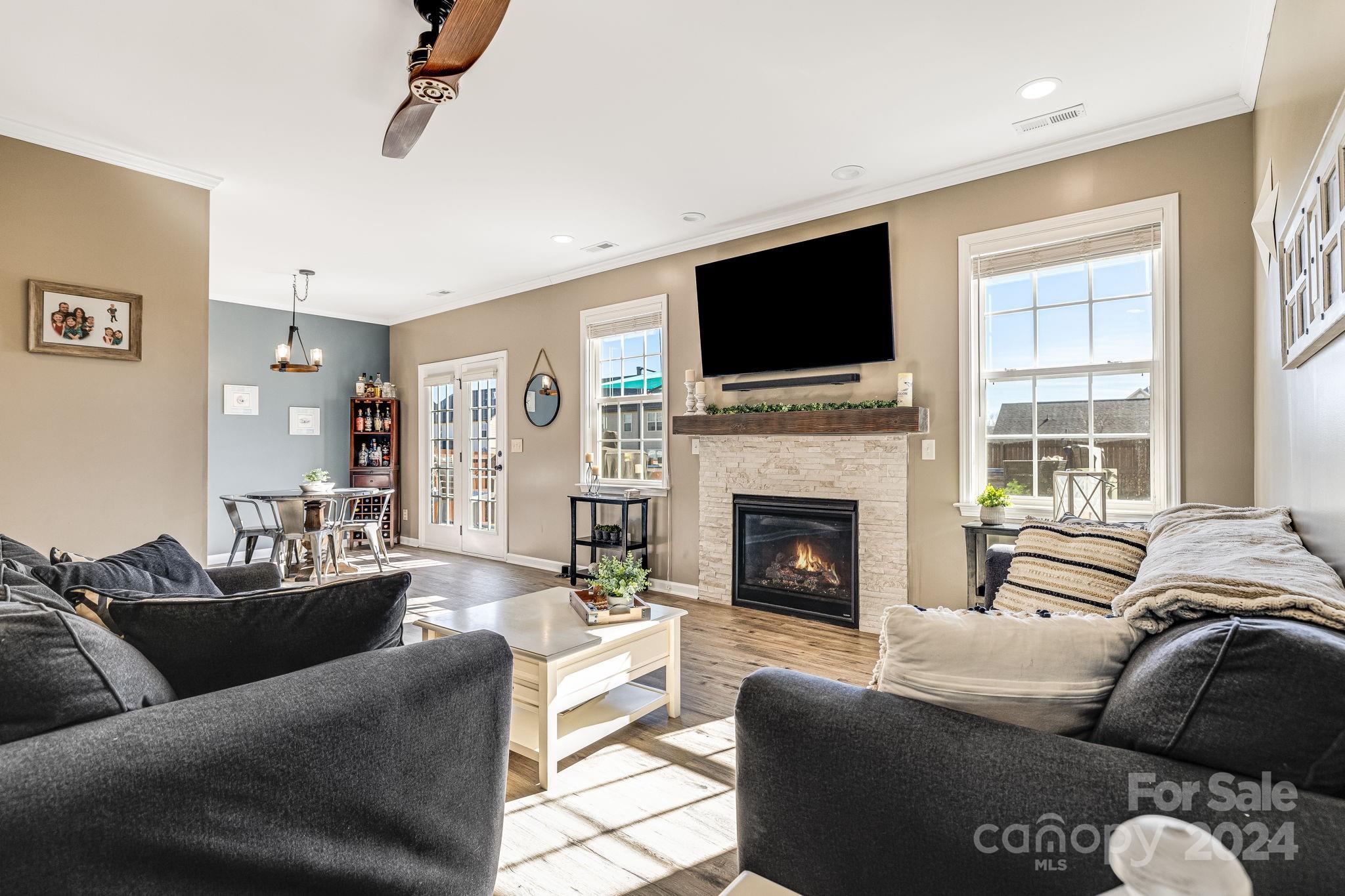 342 West Swift Creek Road Fletcher, NC 28732 - Photo 14 of 44 a living room with furniture a flat screen tv and a fireplace