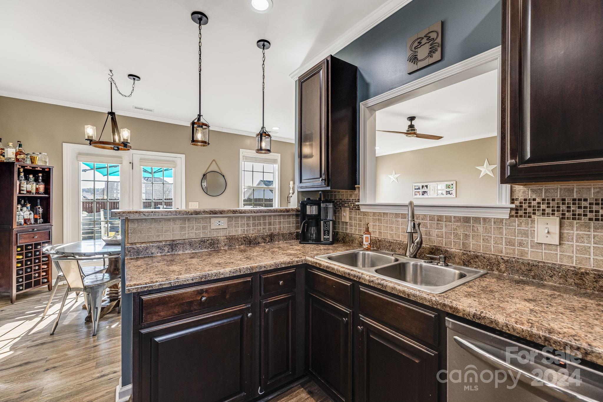 342 West Swift Creek Road Fletcher, NC 28732 - Photo 20 of 44 a kitchen with stainless steel appliances granite countertop a sink a stove and a wooden floor