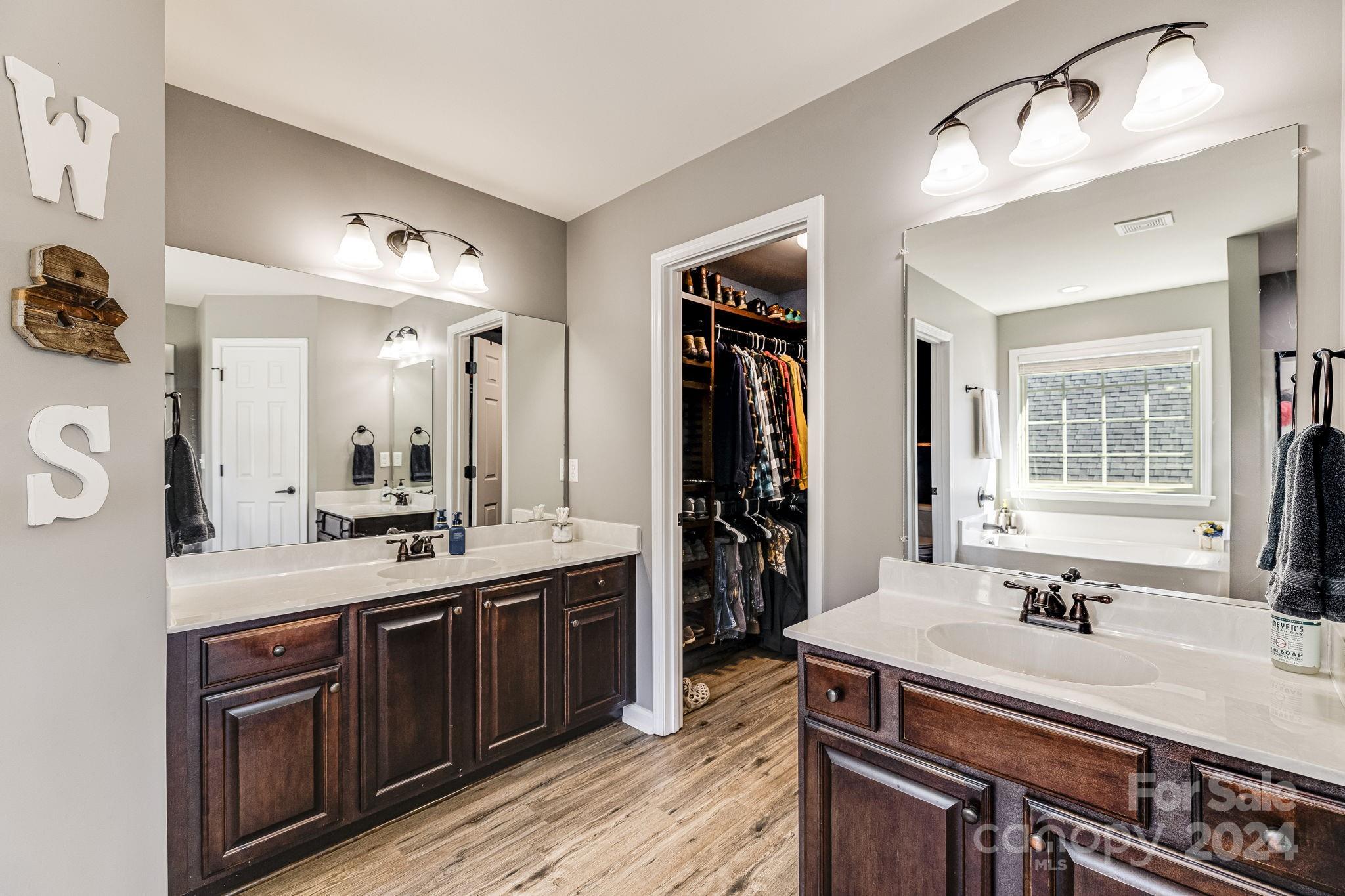 342 West Swift Creek Road Fletcher, NC 28732 - Photo 36 of 44 a spacious bathroom with a sink double vanity and a mirror