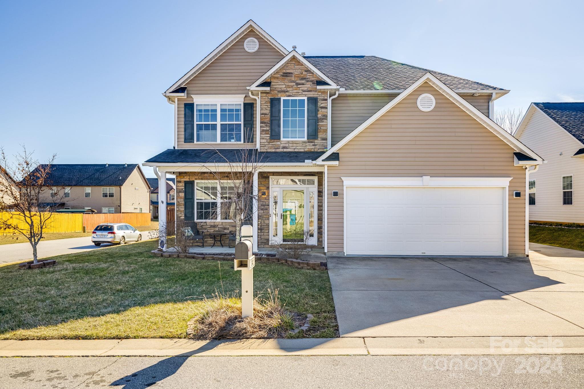 342 West Swift Creek Road Fletcher, NC 28732 - Photo 5 of 44 a front view of a house with a yard and garage