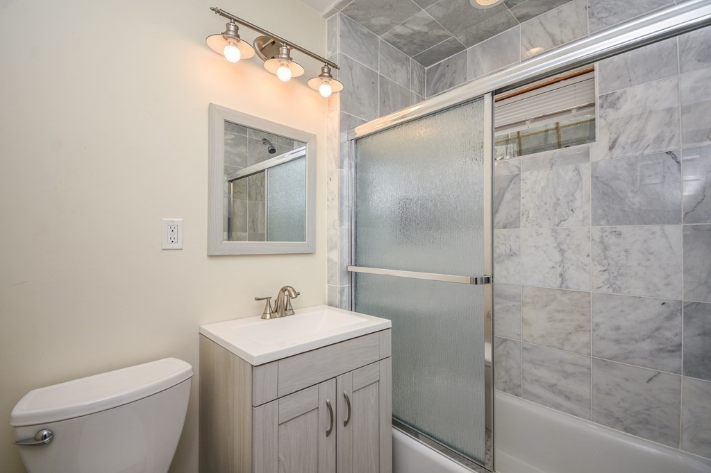 32 Cameron Street Everett, MA 02149 - Photo 12 of 22 a bathroom with a sink toilet and shower