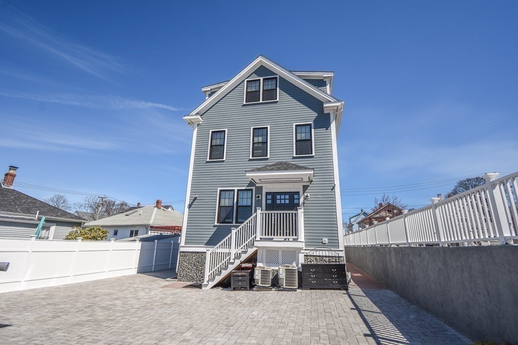32 Cameron Street Everett, MA 02149 - Photo 22 of 22 a front view of a house with a yard