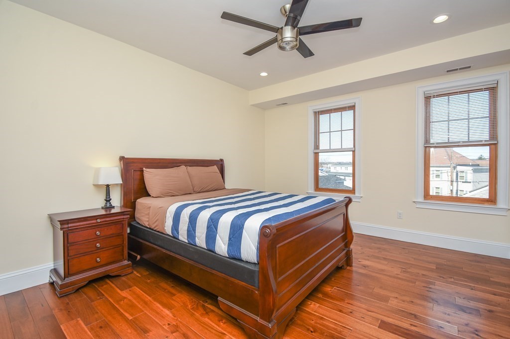 32 Cameron Street Everett, MA 02149 - Photo 6 of 22 a bedroom with a bed and window