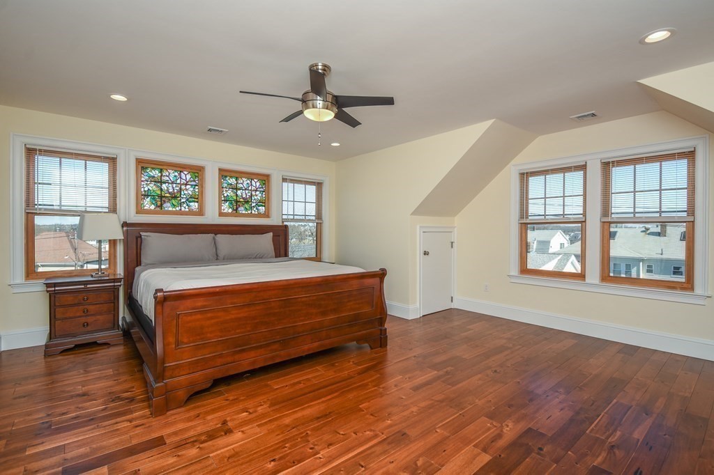 32 Cameron Street Everett, MA 02149 - Photo 10 of 22 a bedroom with a bed wooden floor and window