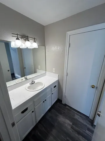 a view of a hallway view with wooden floor and staircase