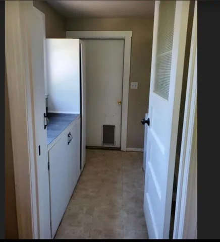 a view of balcony with wooden floor and fence