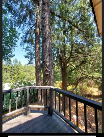 a view of a balcony with wooden floor