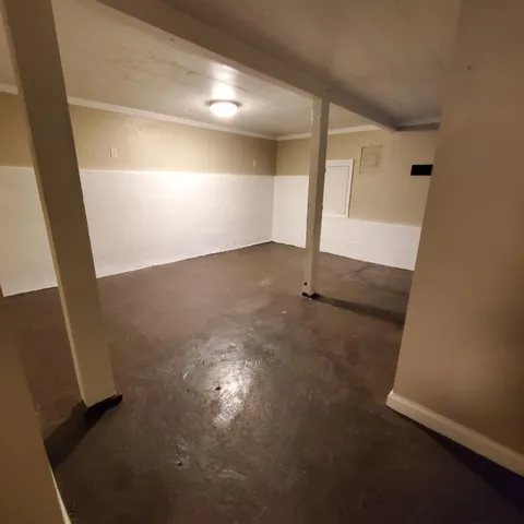 a balcony with wooden floor and city view