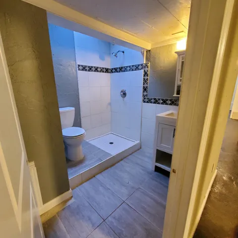 a view of balcony with wooden floor and fence