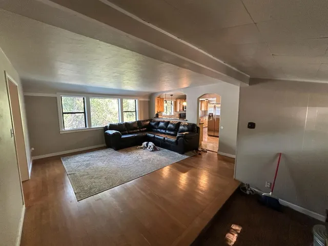 a living room with furniture window and a view of living room