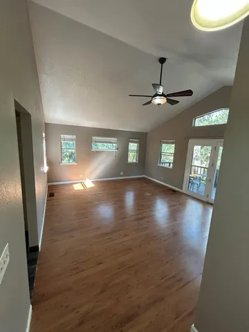 a kitchen with stainless steel appliances granite countertop a refrigerator a stove and a sink