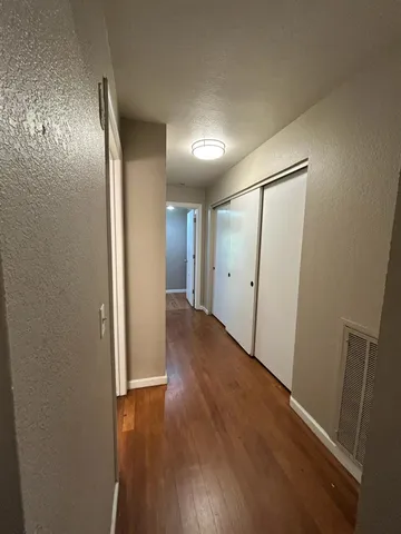 a kitchen with a refrigerator and a sink