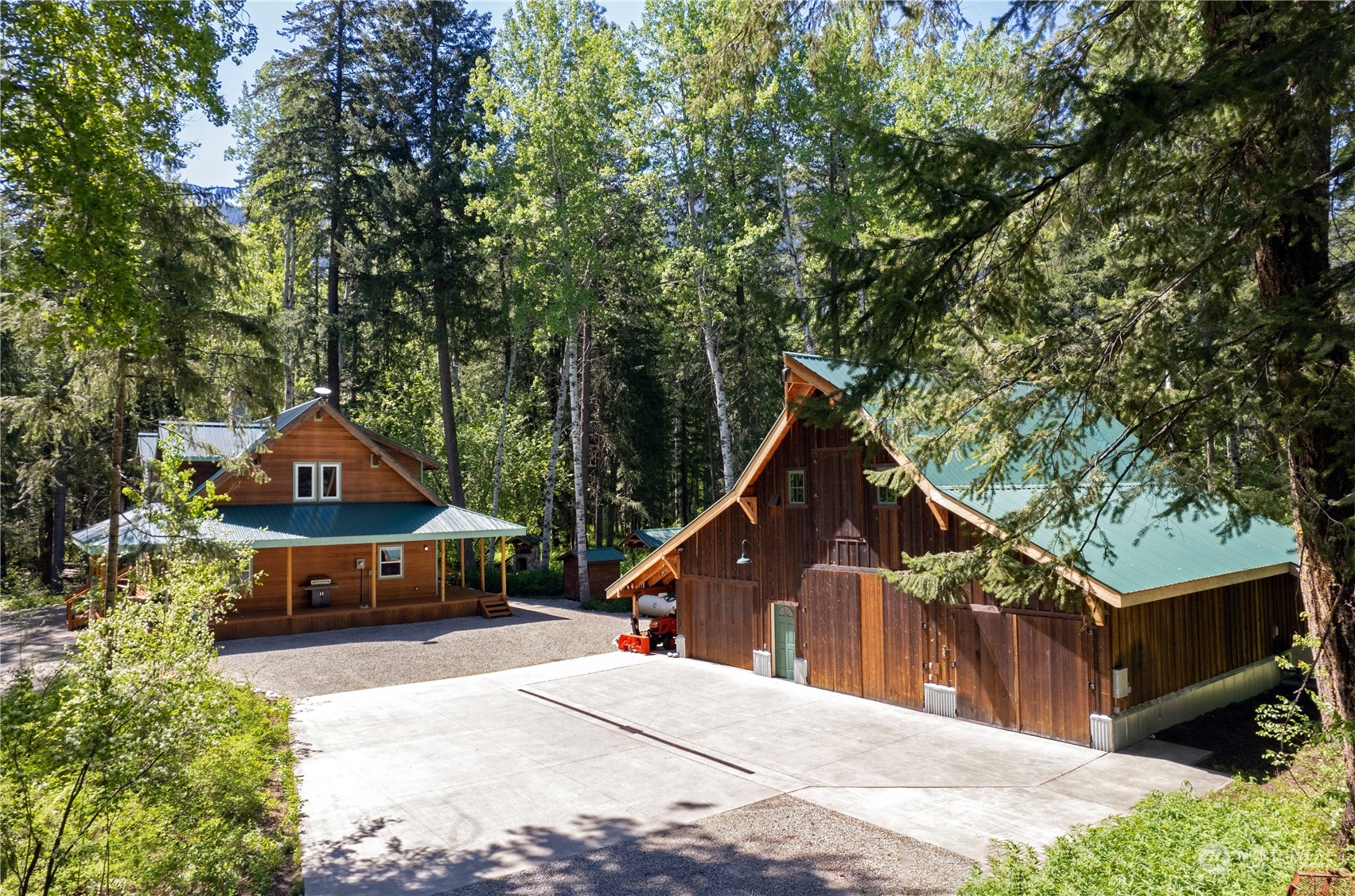 699 Lost River Road Mazama, WA 98833 - Photo 1 of 40 a house with trees in the background