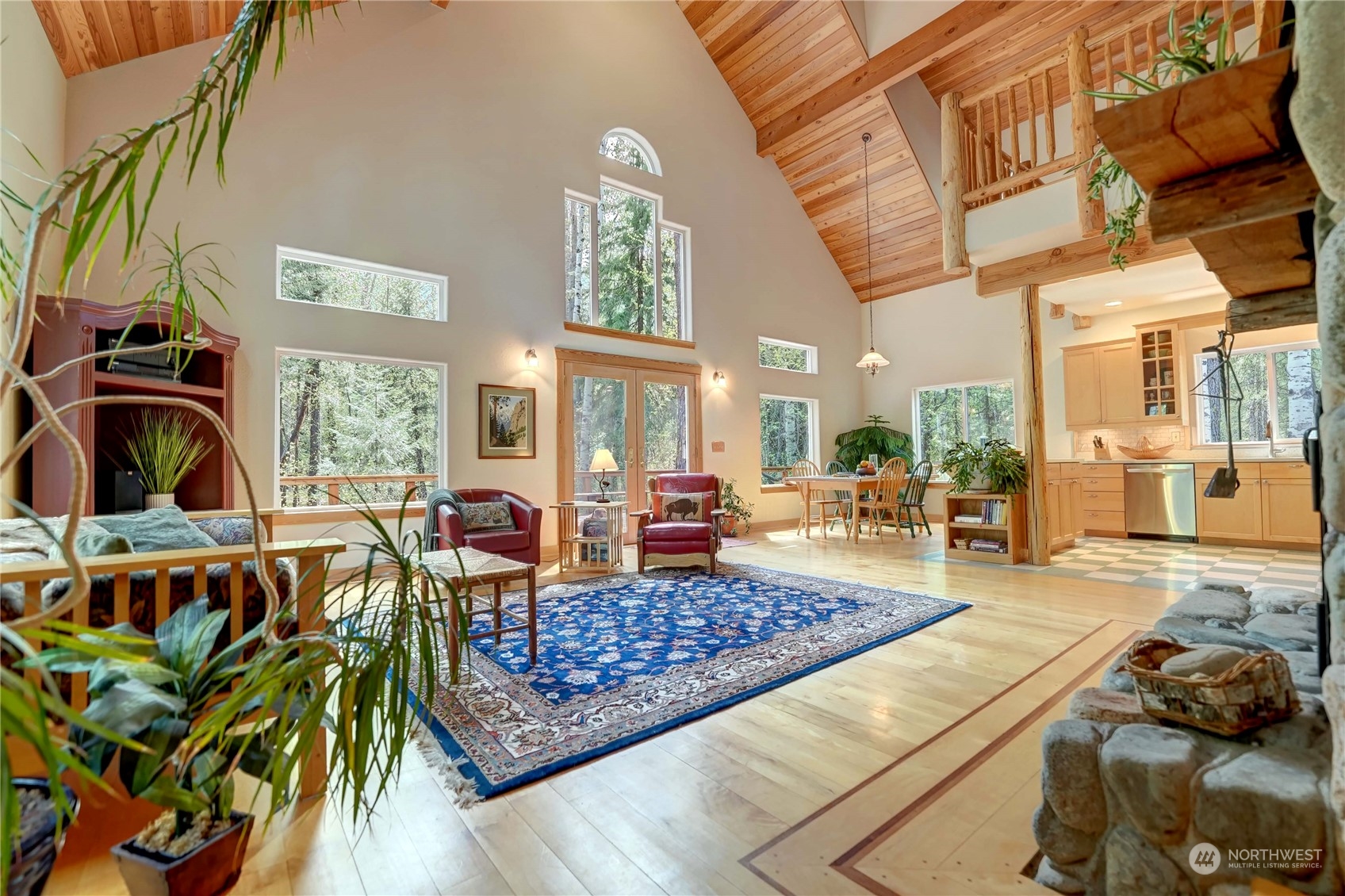 699 Lost River Road Mazama, WA 98833 - Photo 16 of 40 a living room with lots of furniture and a rug