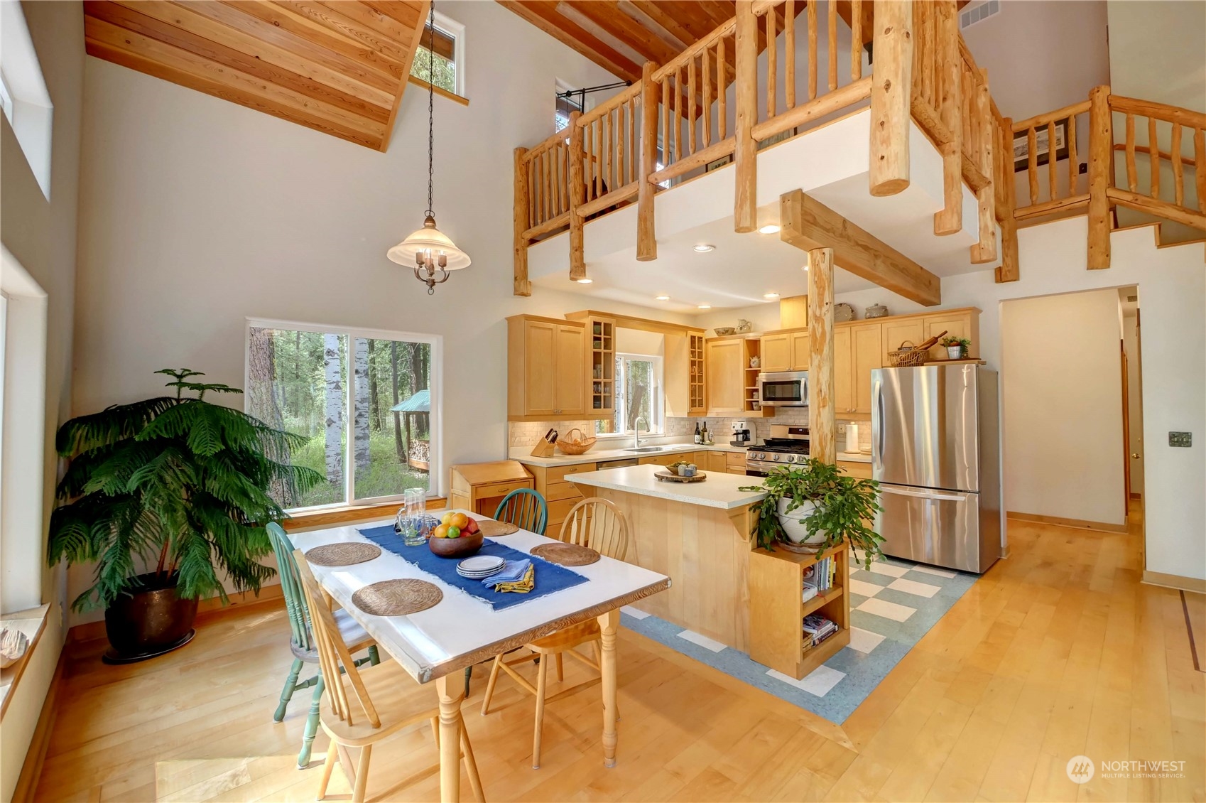 699 Lost River Road Mazama, WA 98833 - Photo 17 of 40 a living room with patio furniture and a floor to ceiling window