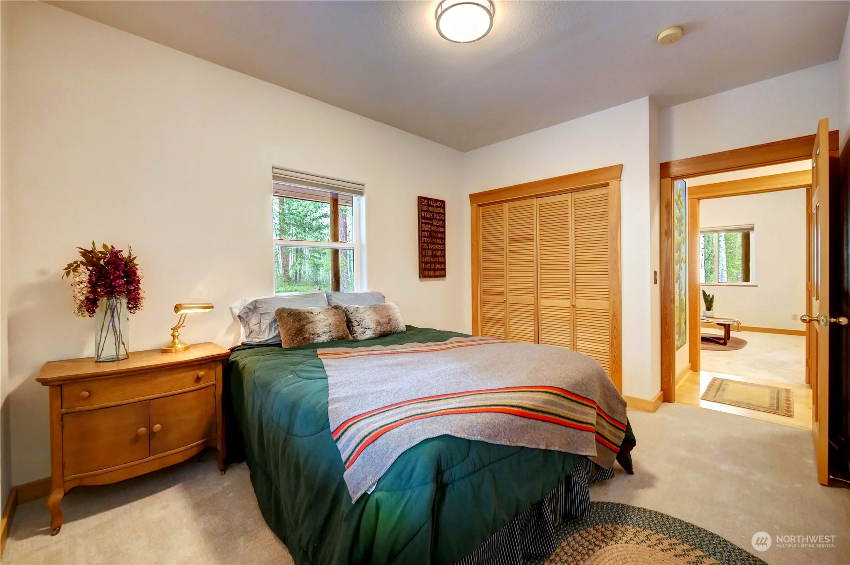 699 Lost River Road Mazama, WA 98833 - Photo 21 of 40 a bedroom with a bed and a dresser