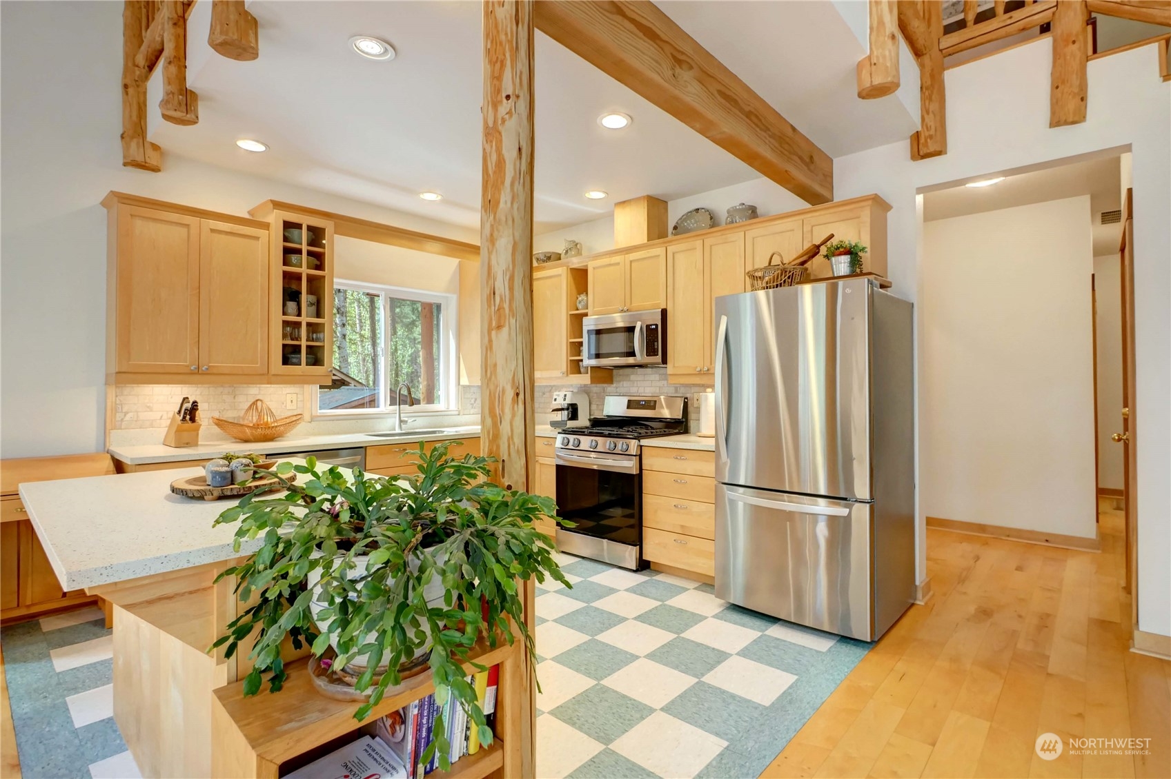 699 Lost River Road Mazama, WA 98833 - Photo 23 of 40 a kitchen with granite countertop a refrigerator and a sink