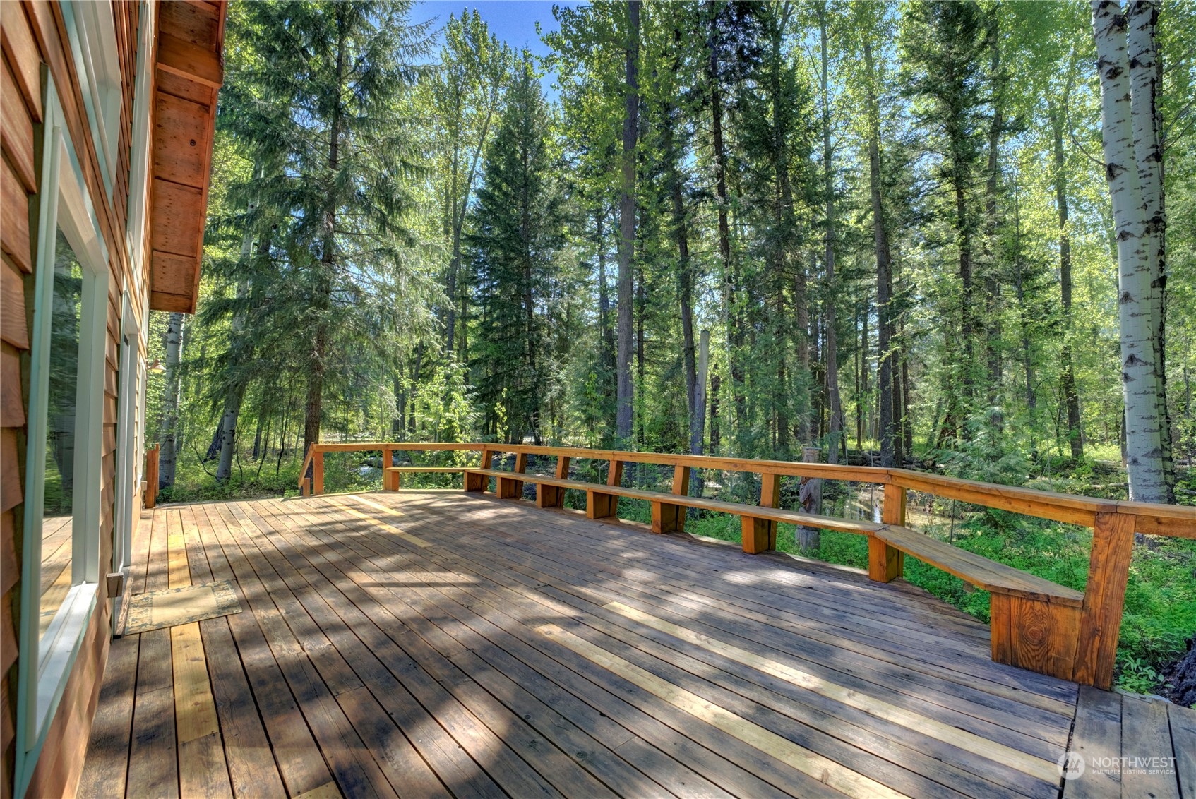 699 Lost River Road Mazama, WA 98833 - Photo 27 of 40 a view of outdoor space with deck and trees