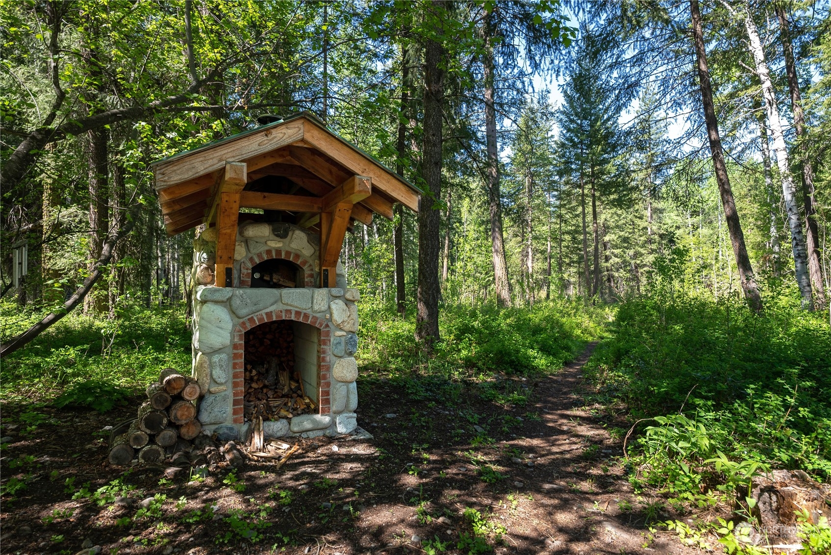 699 Lost River Road Mazama, WA 98833 - Photo 40 of 40 a front view of a house with garden