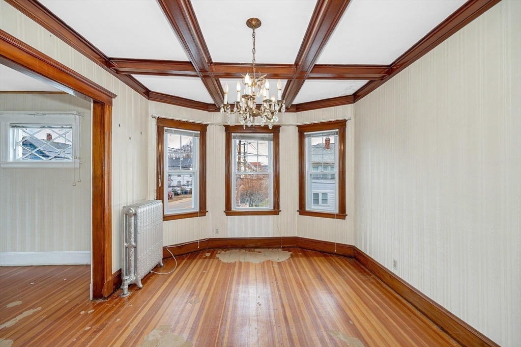 481 Lagrange Street Boston, MA 02132 - Photo 5 of 32 wooden floor in an empty room with a window