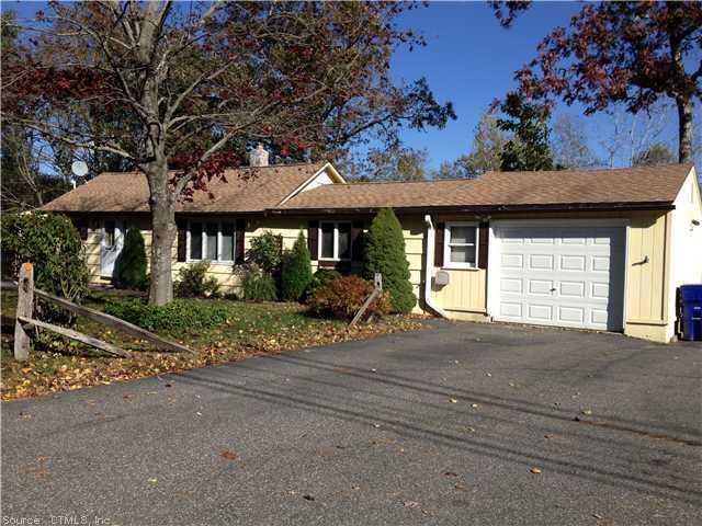 a view of a house with a yard and tree s