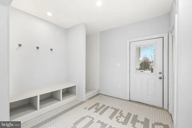 a living room with fireplace furniture and a wooden floor