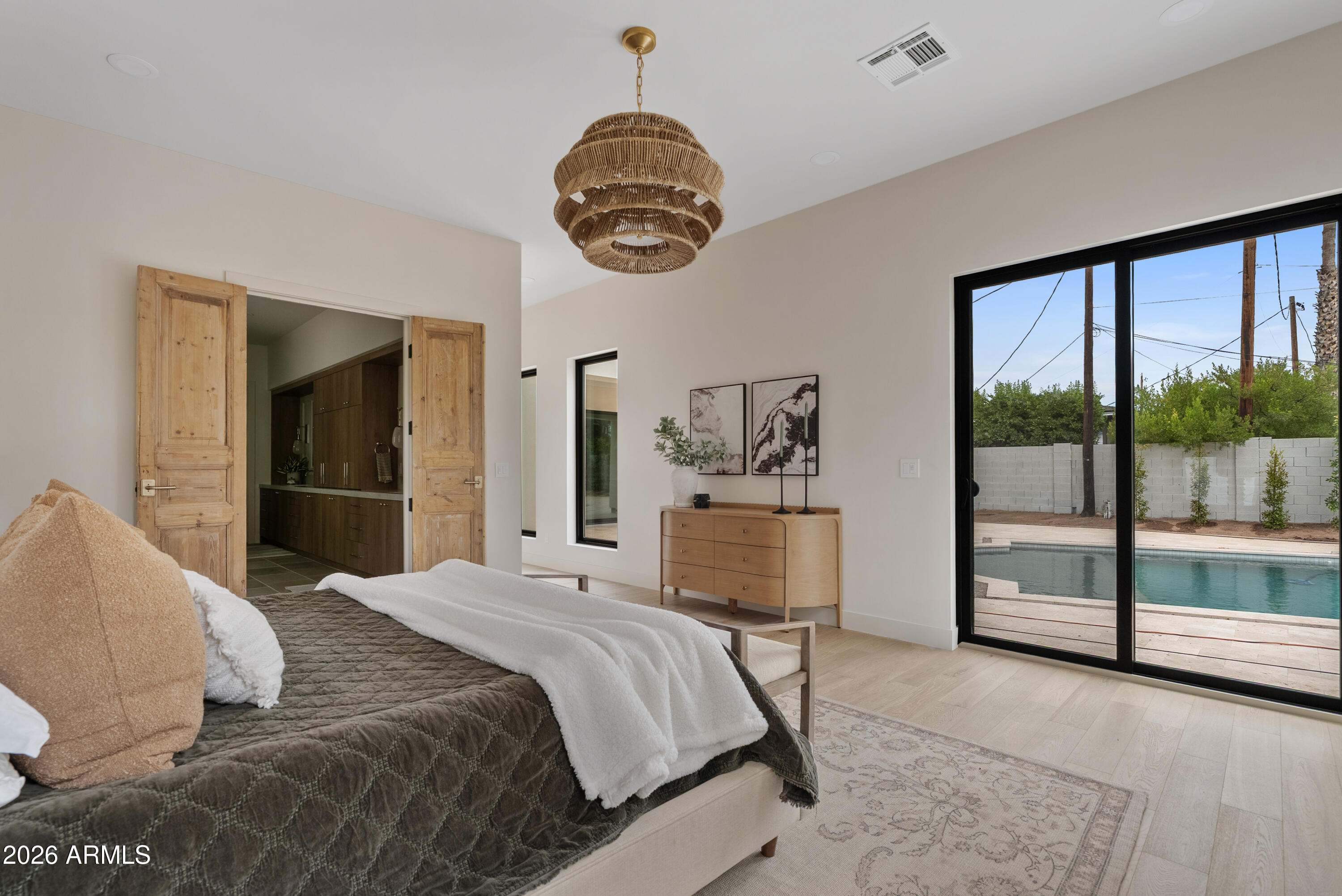 4035 East Osborn Road Phoenix, AZ 85018 - Photo 19 of 63 a bedroom with a large bed and a window
